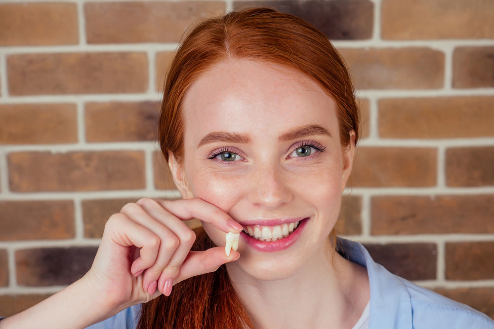 Redheads tend to have thinner enamel than other people, and so the inner layer of dentin is more visible and appears more yellow.